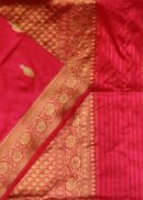 Banarasi silk saree in hot pink colour with all over small zari butis and fancy  zari border. Comes with a running blouse.