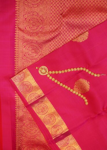 Kanjivaram saree in pink colour. Zari butta, zari border and zari pallu.