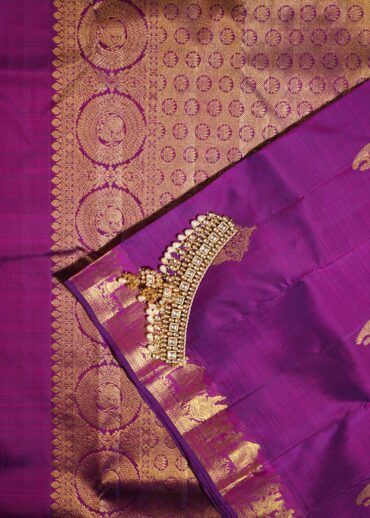 Kanjivaram saree in magenta wine colour. Zari butta, zari border and zari pallu.