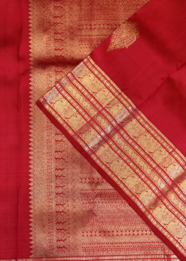 pure kanjeevaram, reddish pink, zari border with all over butis.